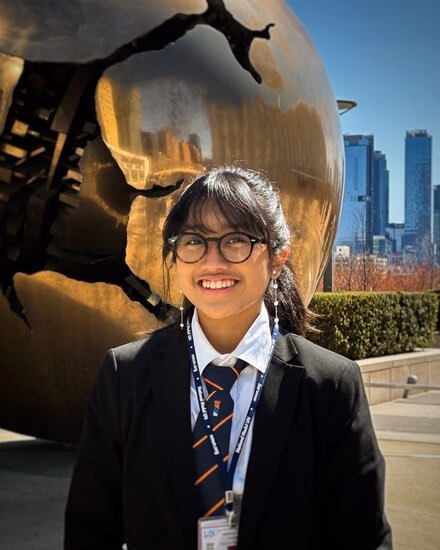 Kayla smiling to the camera