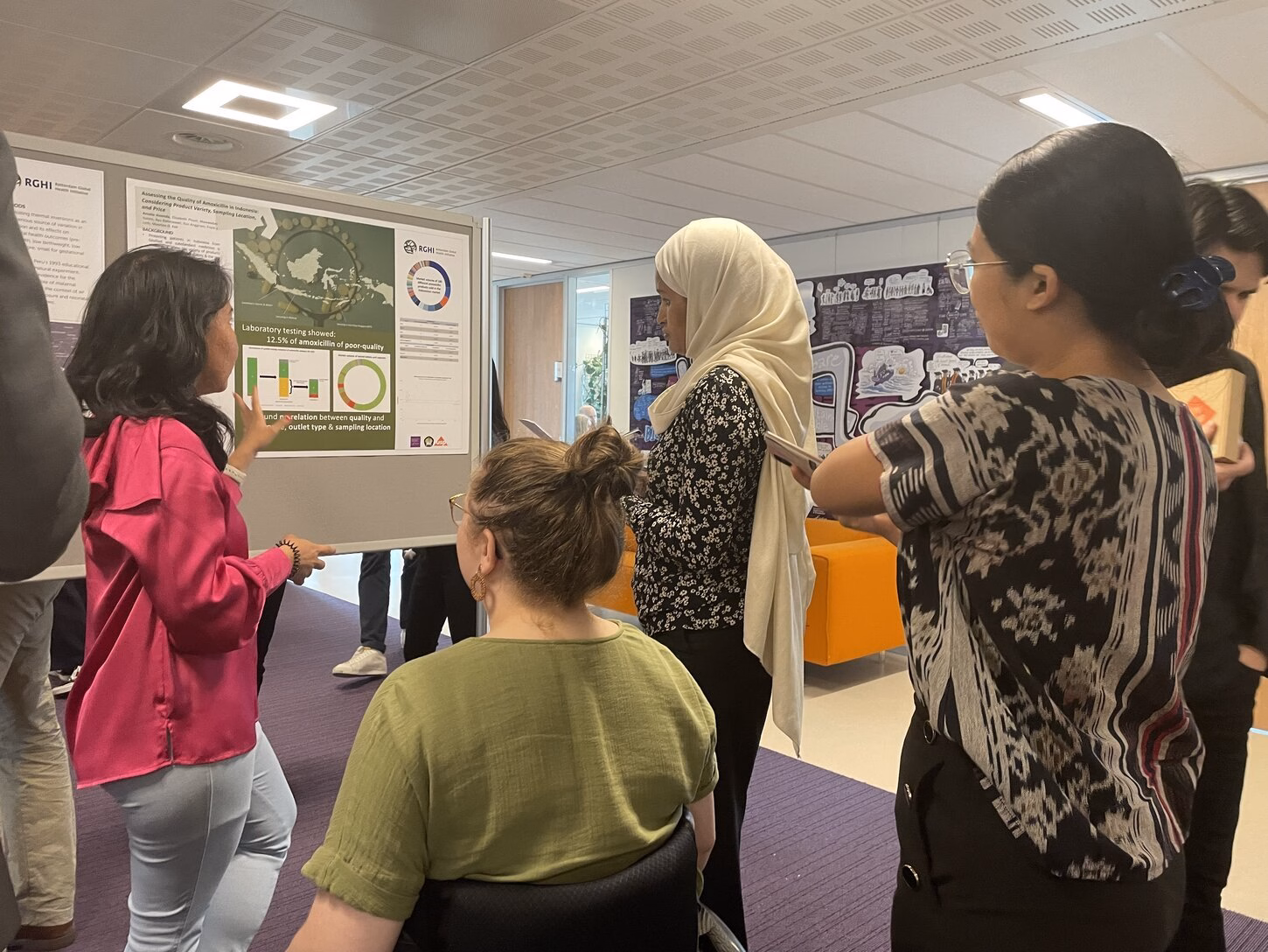 PhD student Amalia Hasnida presenting her work to jury member Zemzem Shigute Shuka and others 
