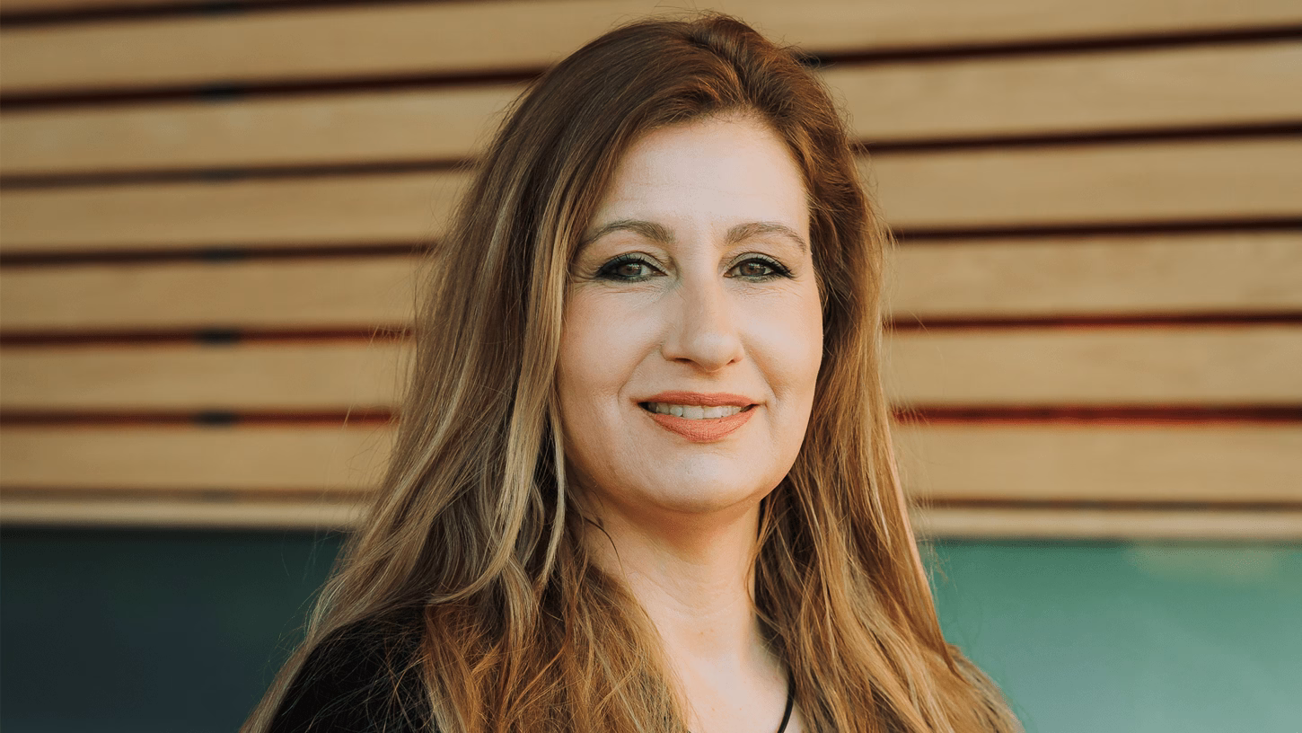 Semiha Denktaş smiles into the camera.