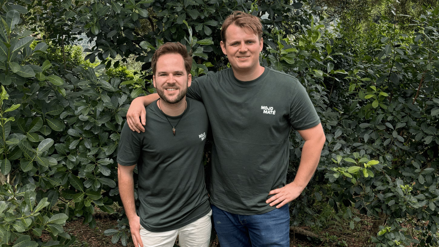 The founders of the drink Mojo Maté pose together wearing t-shirts with the brand's logo