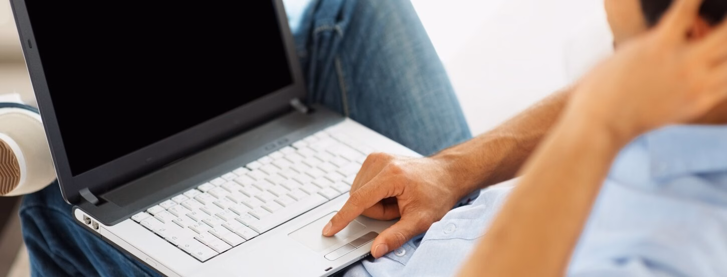 Man behind laptop