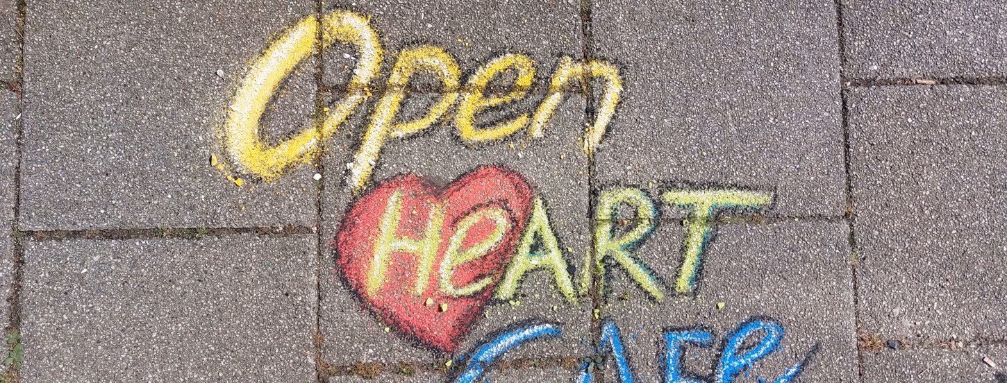 Open Heart cafe written with chalk 