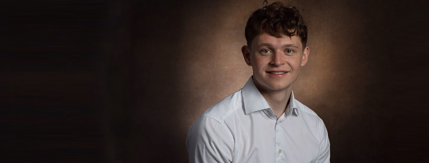 Student smiling at the camera
