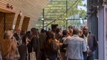 A photo of the crowd socialising in the networking area