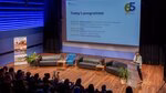 Hanna Schultz, Master of Ceremony, introducing the event programme