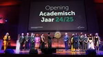 Annelien Bredenoord strikes the gong to open the academic year with all award winners on stage.
