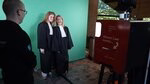 Two law students in togas at the photo booth during the bachelor's open day.
