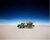 Artwork of a truck in the desert with exploding earth coming out of the trailer