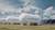 White Hydrogen H2 tanks with wind turbines and solar panels under cloudy sky