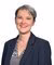 Anne Boring, woman with gray hair wearing a navy blazer and patterned blouse