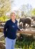 Belinde Bakker standing in front of an elephant