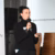 Medha Pfaff is speaking and is holding a microphone.