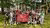 Criminology students holding up the Erasmus School of Law flag in Hamburg
