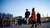 Podcast interviewer walks through Rotterdam with guest for podcast recording.
