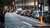 A long row of cars waiting for a red traffic light in the city center of Rotterdam.