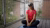 Cleo Anderson wearing the Apple Vision Pro whilst doing yoga on her balcony.