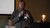 Tommy Blomvliet gives a speech to an audience with a microphone in his hand.