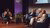 Three old white men being interview by a young black woman