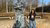 Hima Varshini looks into the camera while standing next to the Erasmus statue on Campus Woudestein.