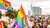 Group of participants during Pride March in Rotterdam with all kinds of (rainbow) flags