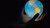 hands in the dark holding a glowing globe