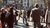 Group of people are listening to a speaker on the streets