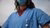 Female doctor in blue operation room clothes