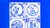 four porcelain tiles featuring typical dutch motives in delft blue