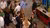 Overhead view of people mingling at a conference refreshment area