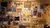 Photograph of wooden wall with photos, objects and colored wires linking them in a network