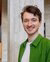 Masterstudent Floris glimlacht in de camera.