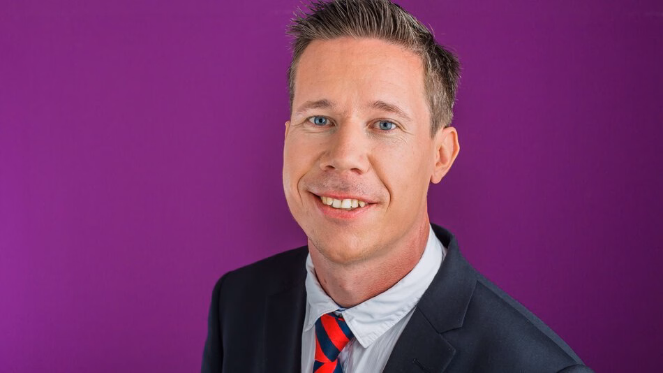 Photo of Dr Arthur Attema against a purple background